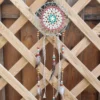 Suspentes légères composées de perles en bois céramique plumes et rubans assortis
