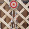 ar petit cerclage metal rouge orange alterné 3 Suspentes légères composées de perles en bois céramique plumes et rubans assortis