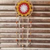 Attrape rêves chanvre rouge fait main avec cerclage encordé en chanvre plumes et rubans en tissu