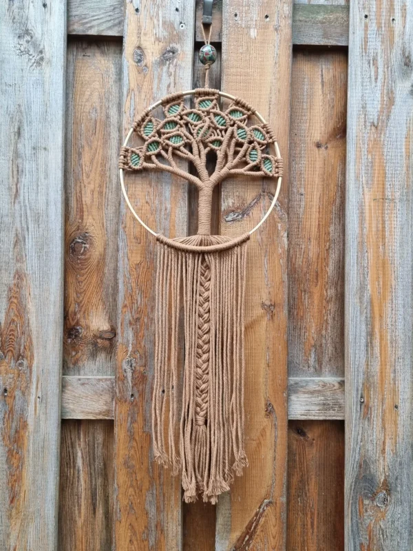 arbre de vie frange brune 2 Attache ornée d une perle en bois au-dessus du petit cerclage en bois
